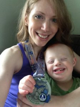 Melissa, baby and 25K medal