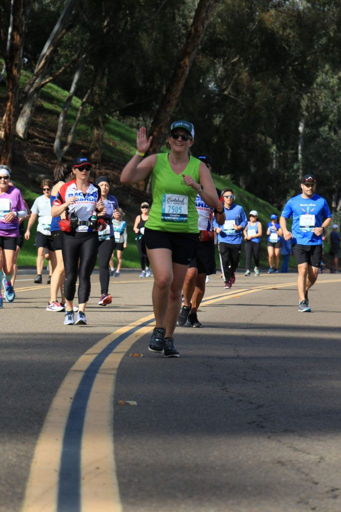 Christine waving and running