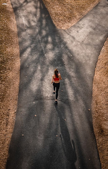 a person running toward a fork in the road