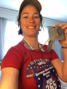 Heidi with marathon medal