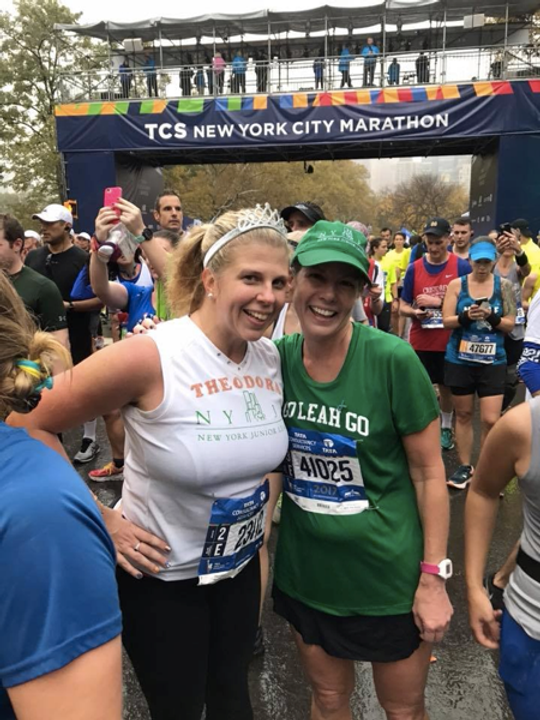 Friends posing for a photo at the TCS New York City Marathon