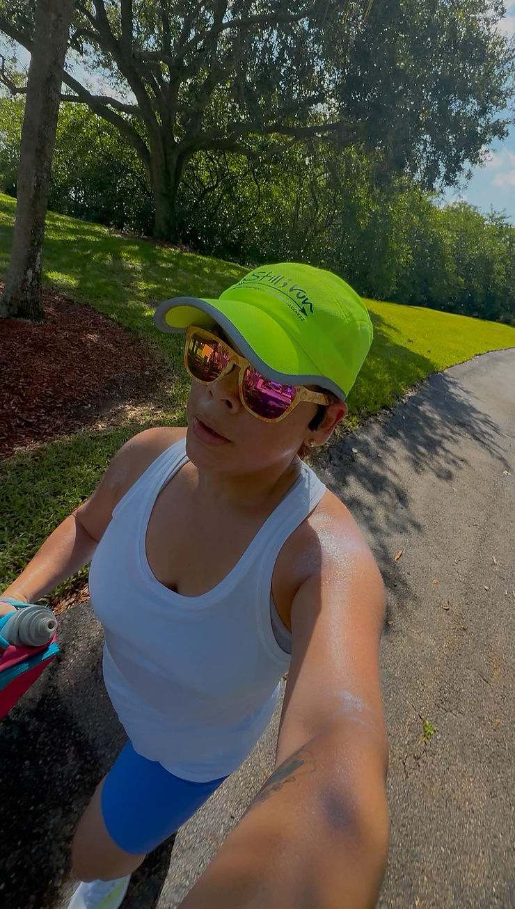 a runner wearing a Still I Run hat and participating in a runstreak