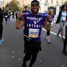 a runner showing off his jersey