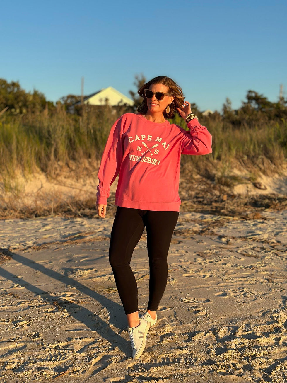a woman posing on the beach