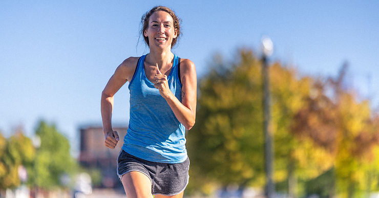 a woman running in the heat