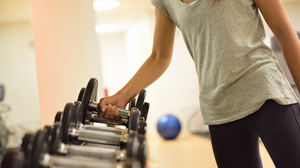 a person picking up a barbell
