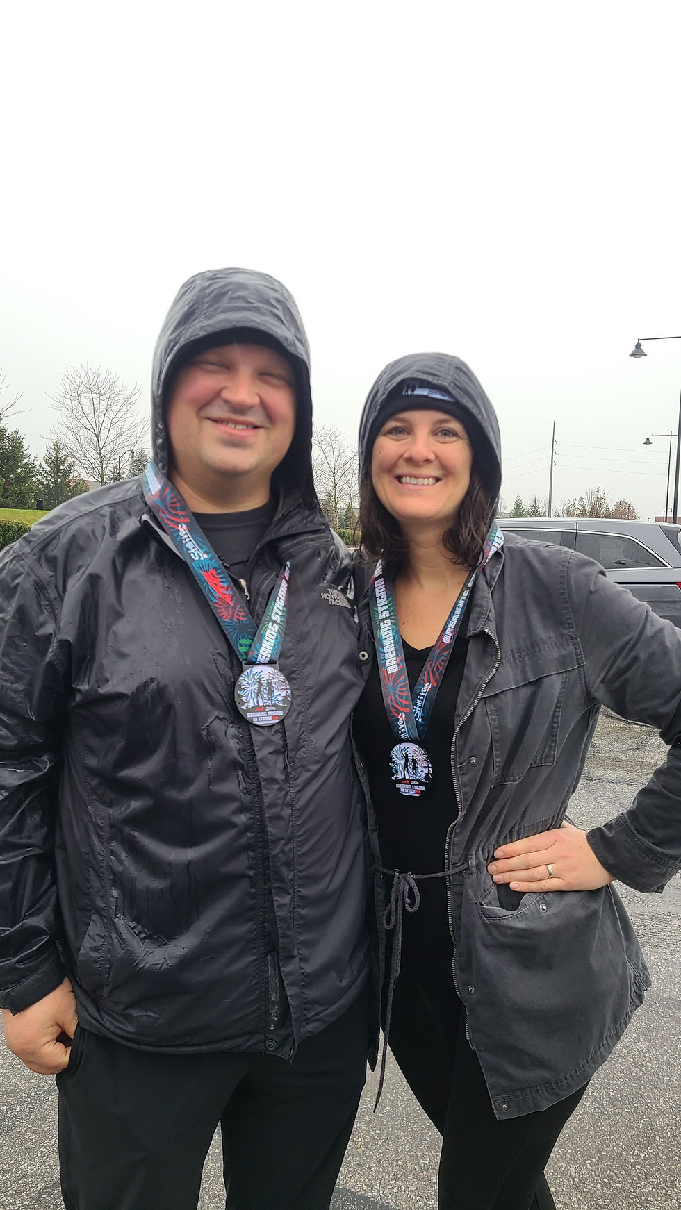 two runners dressed in rain gear