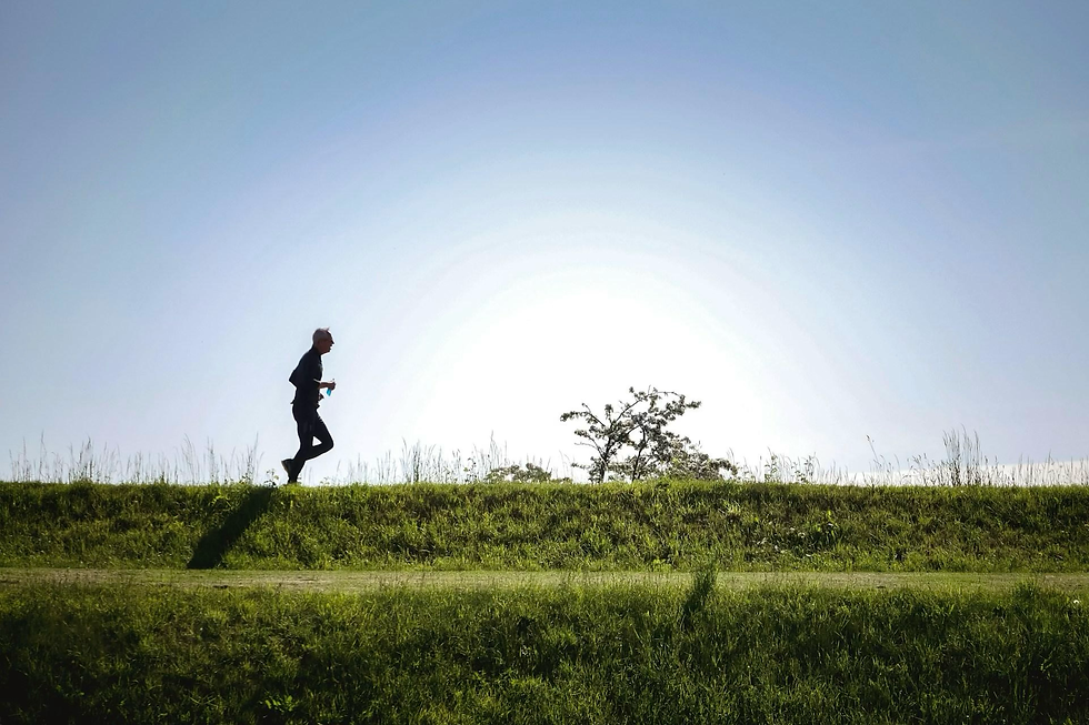 someone running on a grassy path