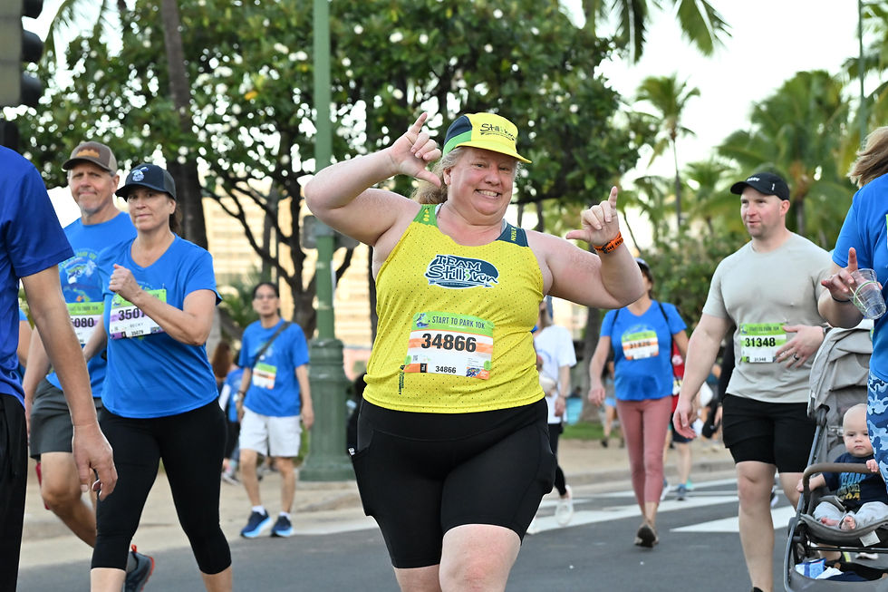 a woman running and smiling in Honolulu