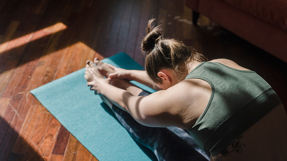 a person doing yoga as part of active recovery while training for a 5k