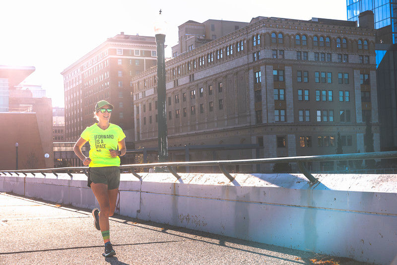 a person running across a bridge