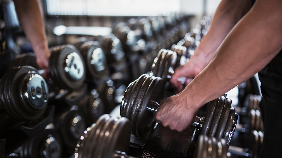 a person grabbing dumbells