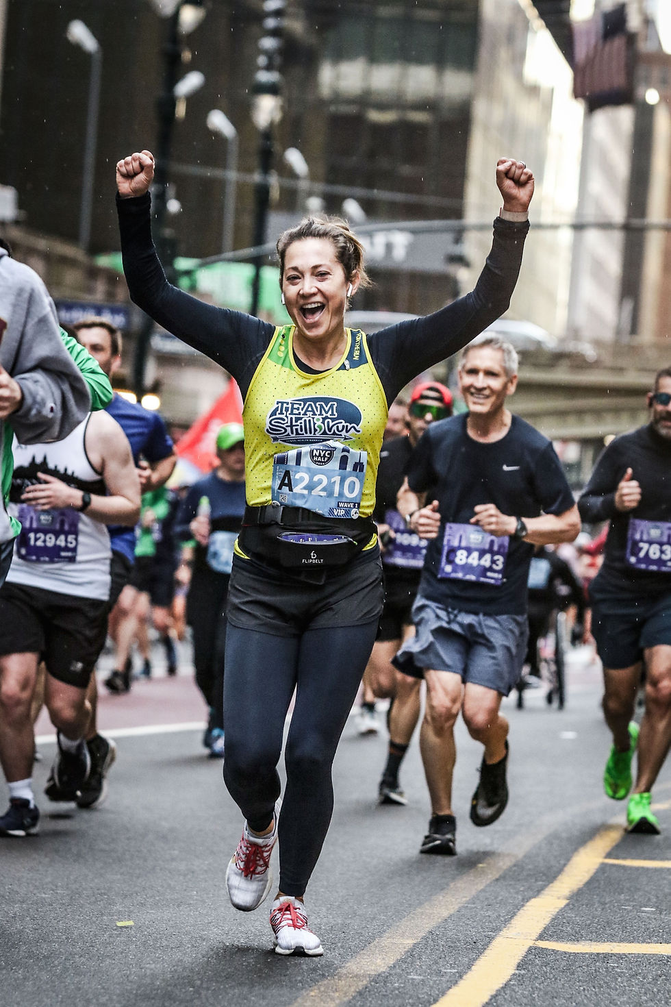 a woman running the new york city marathon