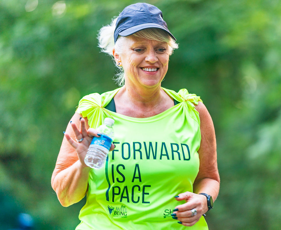 a person running in the heat with a water bottle