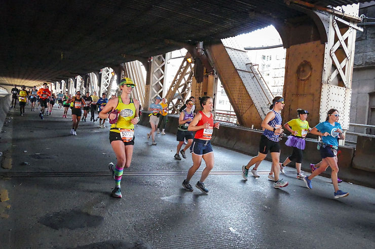 Runners crossing a bridge during the New York City Marathon.