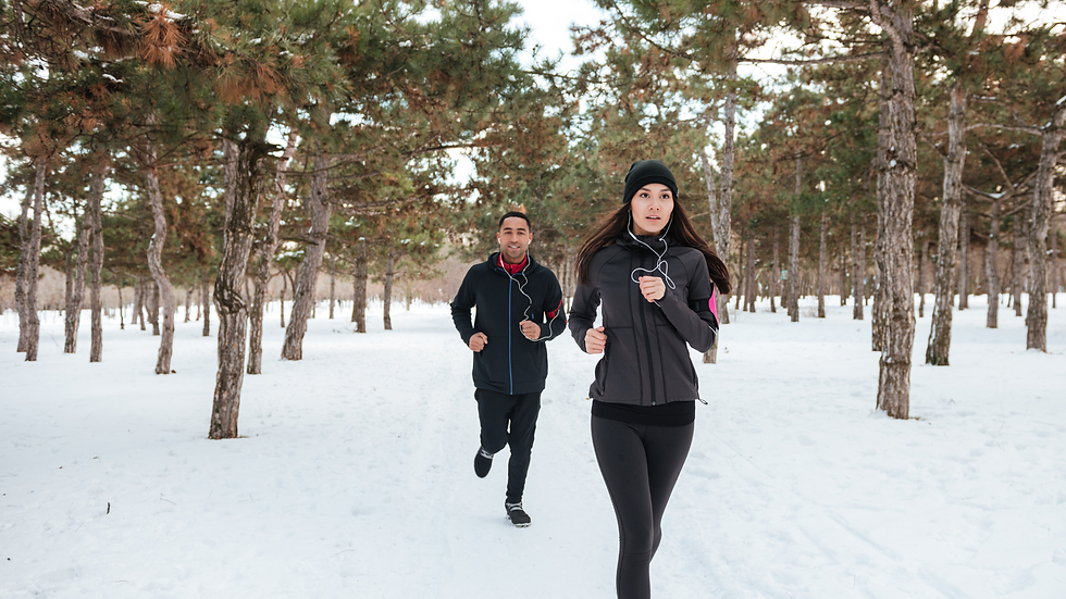 two people running in the snow
